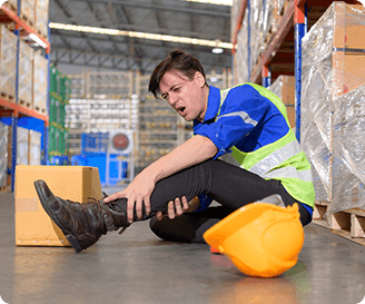 Injured warehouse worker after a workplace incident, highlighting the importance of effective incident tracking and safety practices.